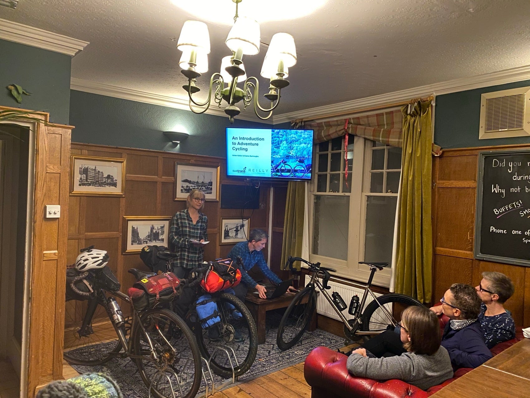 Reilly titanium bikes stored in a hotel room with a television