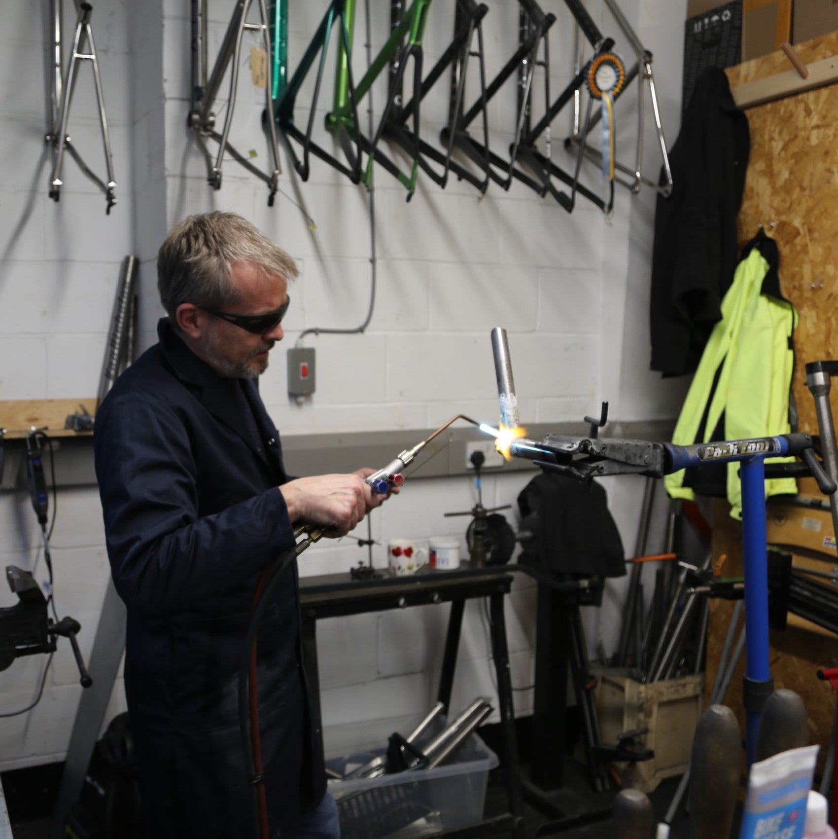 A man learns to weld a titanium bike frame at the Reilly framebuilding school 