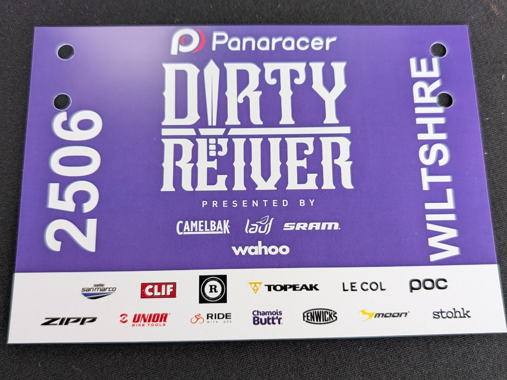 a  purple sign which says 'dirty reiver' with '2506' and 'wiltshire' vertically written on the sides.