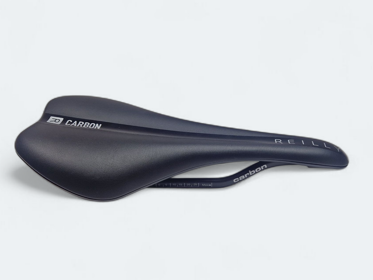 Black bicycle saddle with 'REILLY' branding on a white background