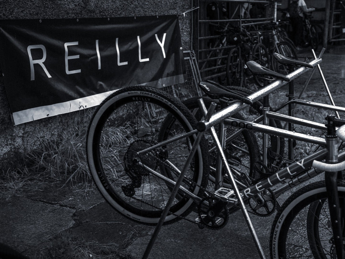 Bicycles with 'REILLY' branding in a black and white setting.