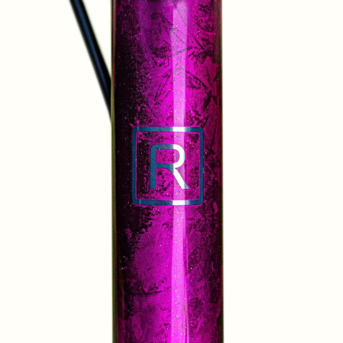 Custom paintwork finish on a titanium road bike in pink , purple and silver