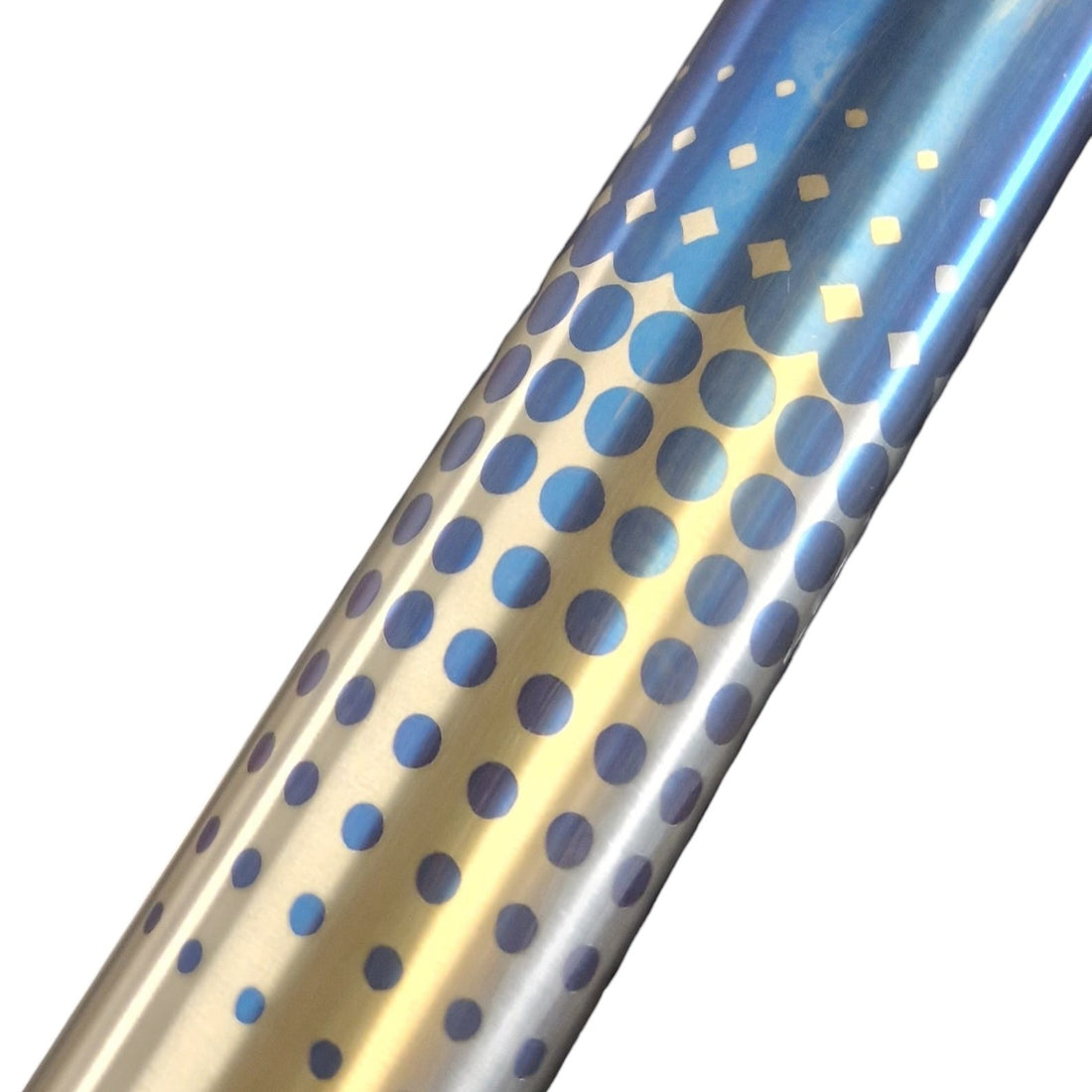 Polka dot pattern in blue anodized onto a titanium bike frame 