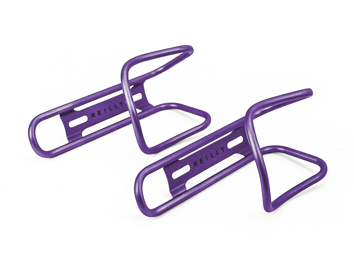 Purple ti bottle cages on a white background.