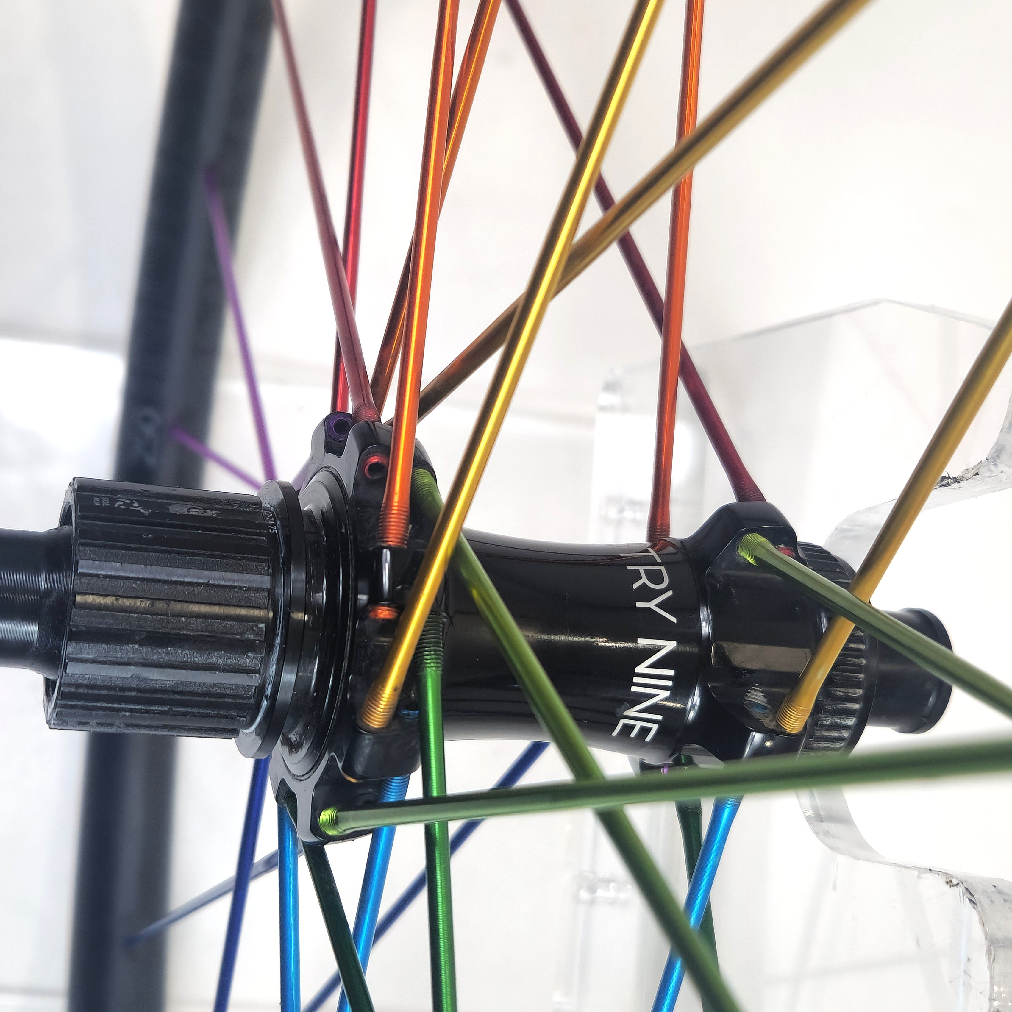 Close-up of a bicycle wheel with colorful spokes .