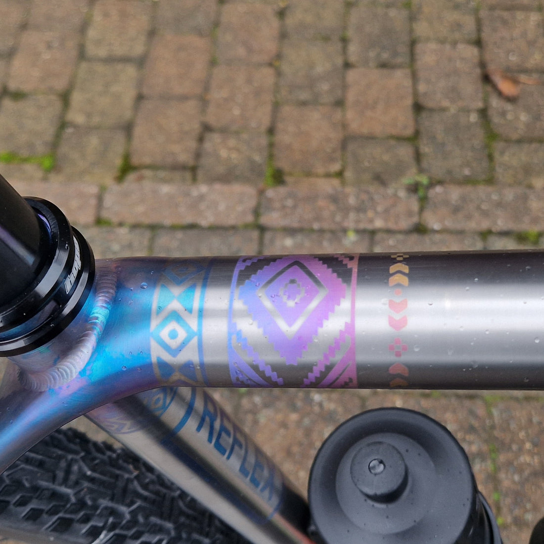Close-up of a bicycle frame with ano finish.