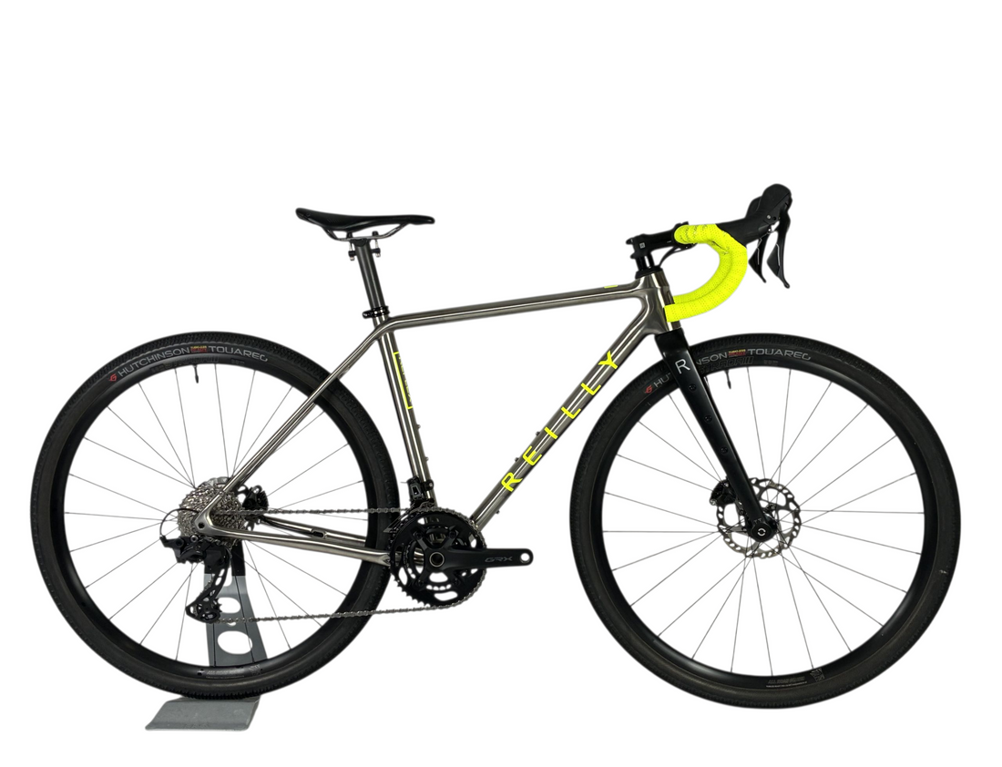Titanium bicycle with yellow accents on a white background