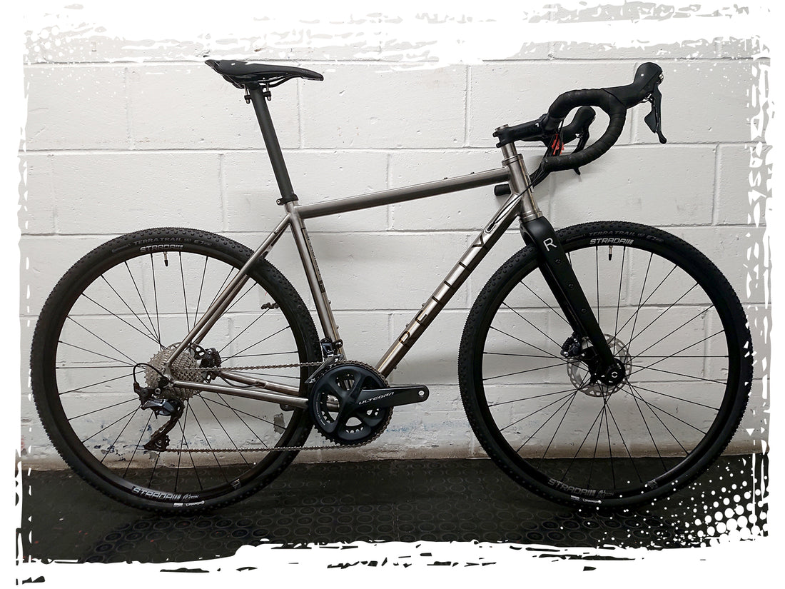 custom Reilly titanium bike with black accents and decals