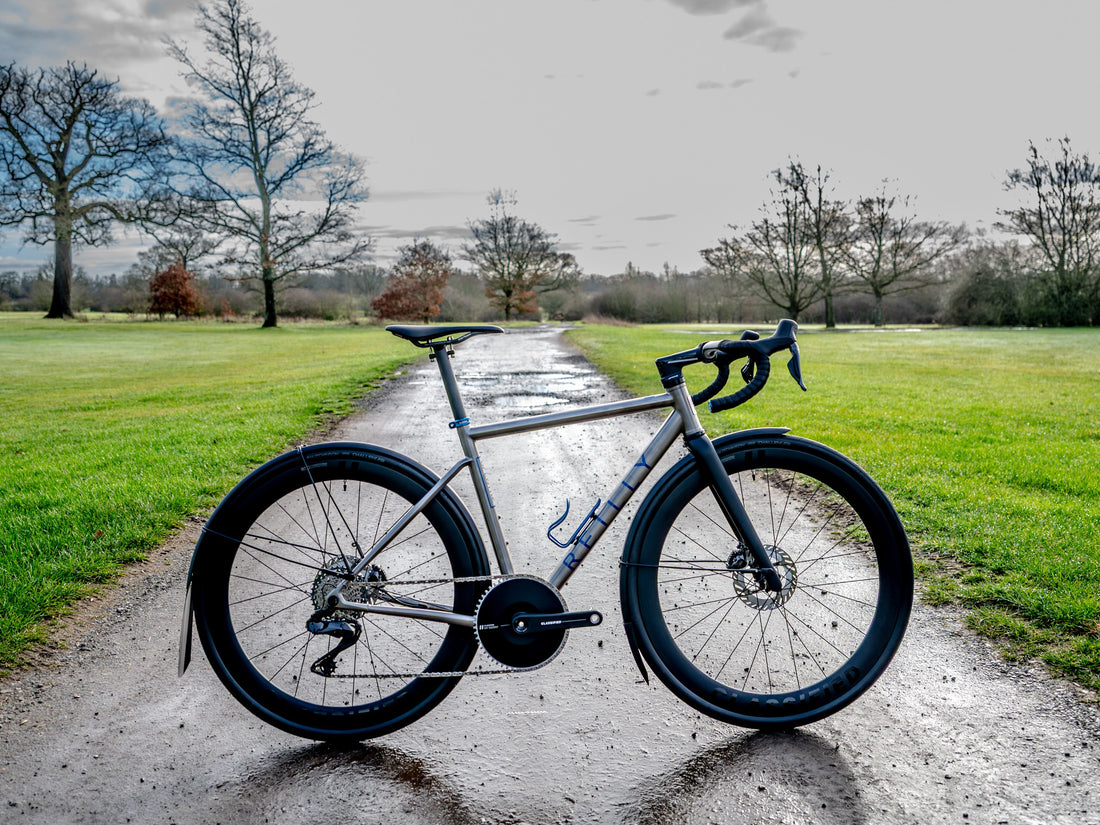 Bicycle on a path with grass and trees in the background