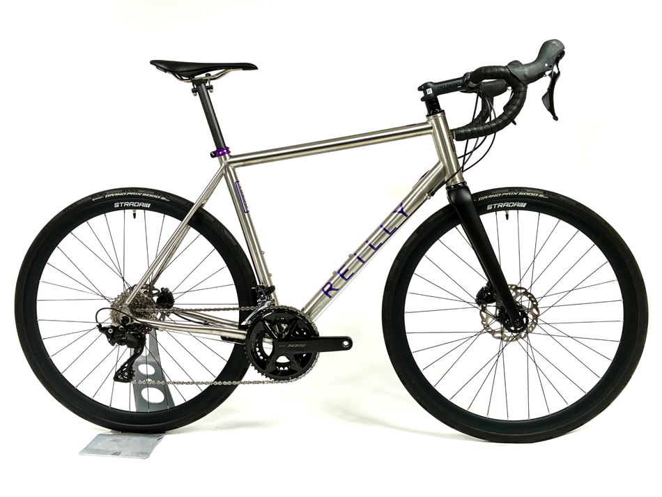 Silver bicycle with black components on a white background