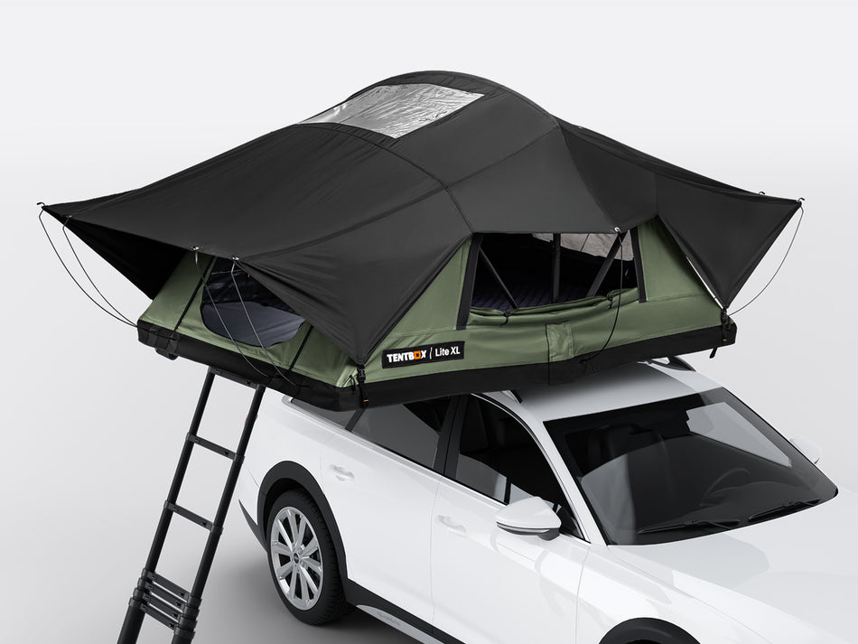 Roof top tent attached to a white SUV on a gray background