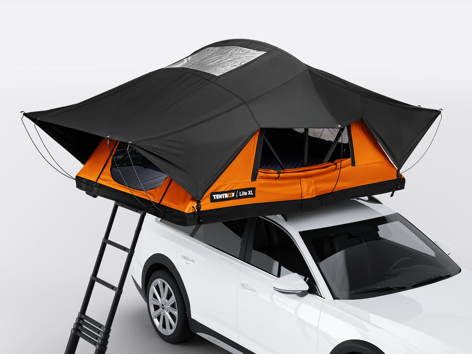Orange and black rooftop tent on a white car with a ladder