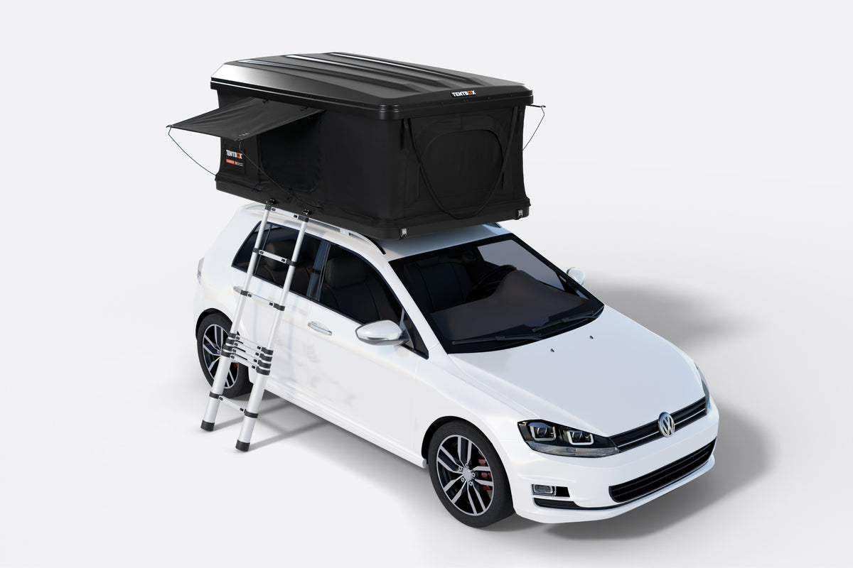White car with a black rooftop tent on a white background