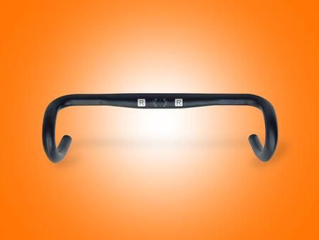 Black bicycle handlebar on an orange gradient background