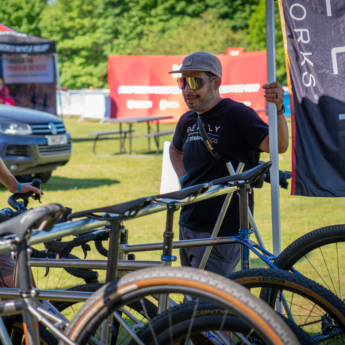 A man in Reilly Tshirt looks at bikes.