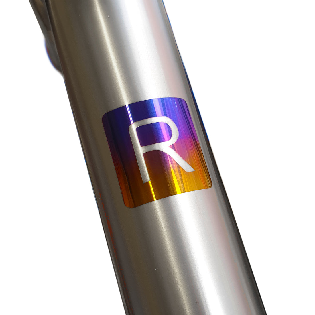 Anodised R in rainbow colours on to a titanium bike