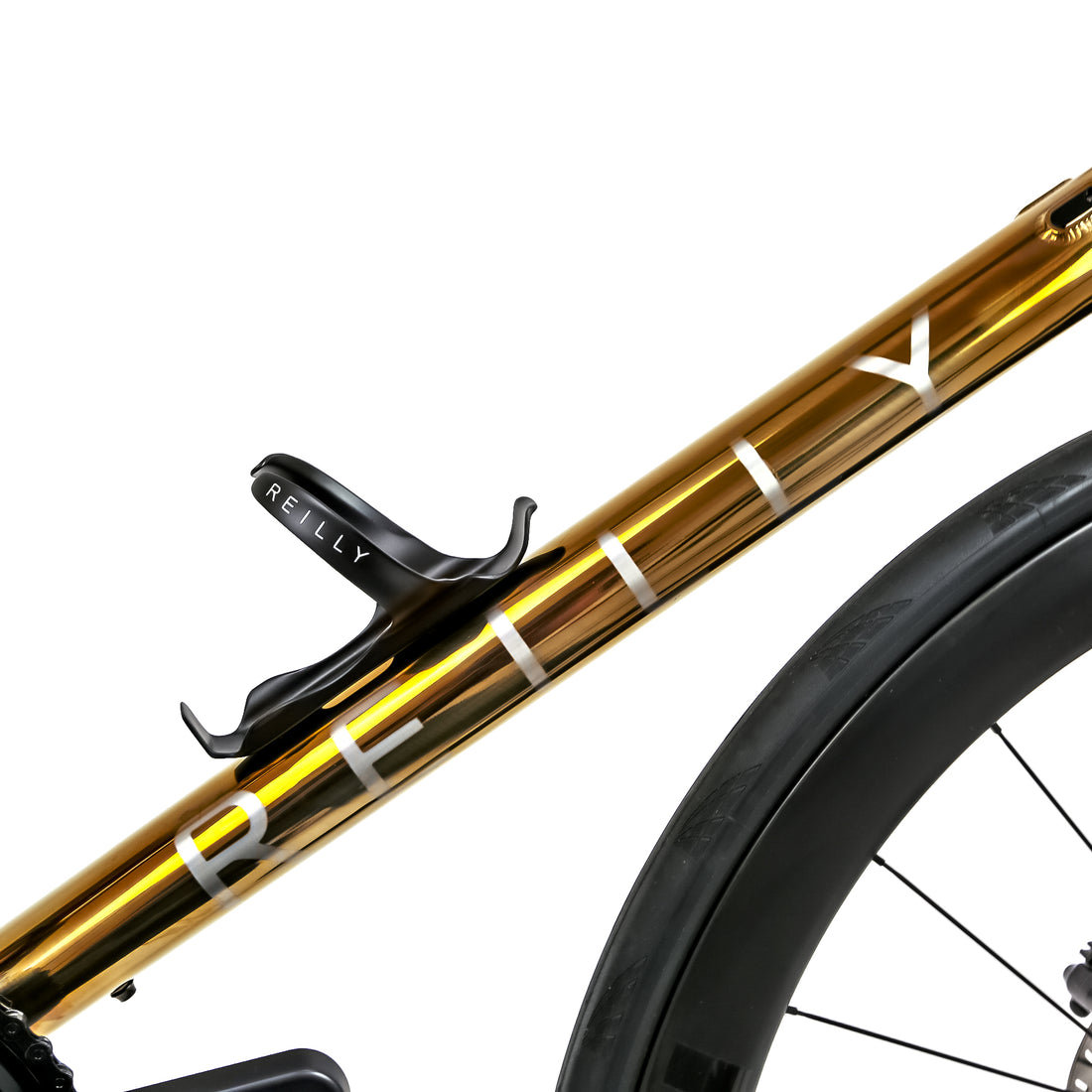 Polished gold Reilly road bike with titanium bottle cages