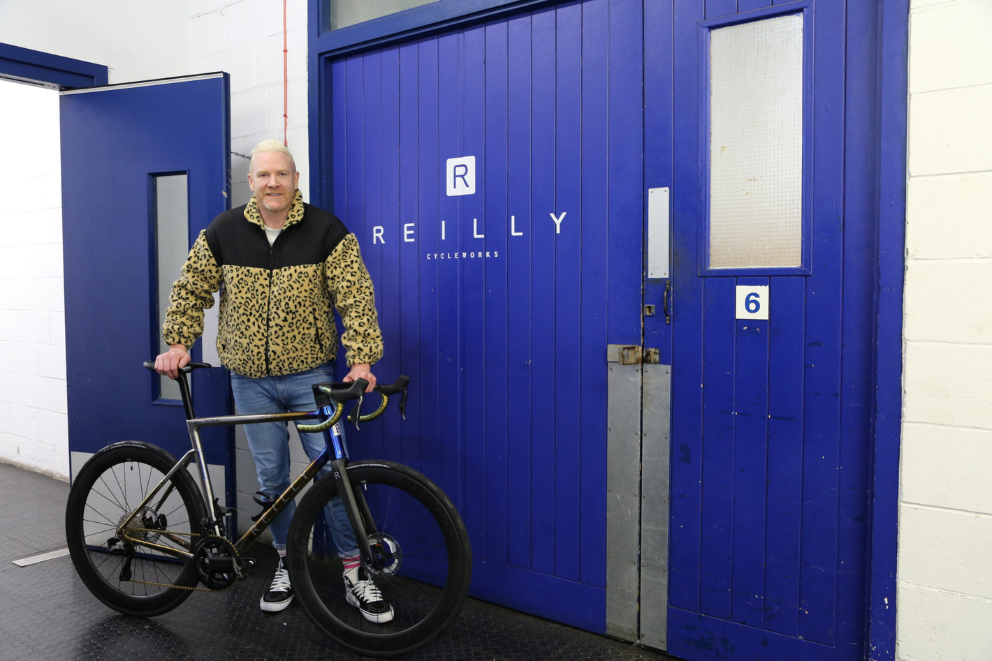 Iwan Thomas cyclist posing with Reilly Titanium bike