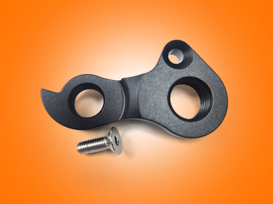 Metal bracket with two holes and a screw on an orange background