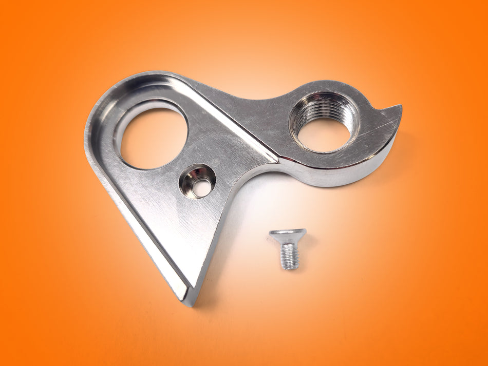Metal bracket with two holes and a screw on an orange background