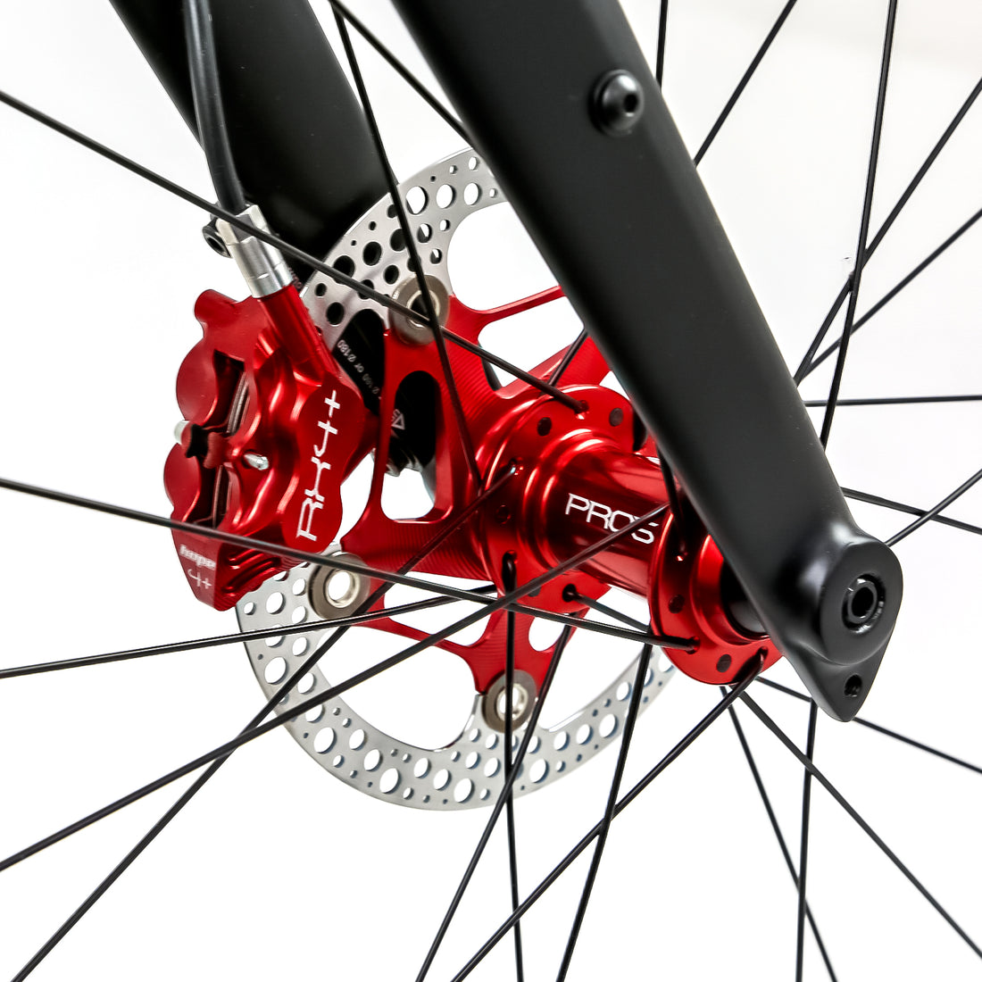 Reilly gravel bike with red brake callipers and wheel hubs