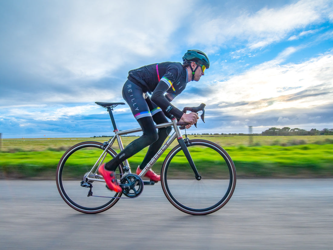 Cyclist using a titanium road bike with rim brakes