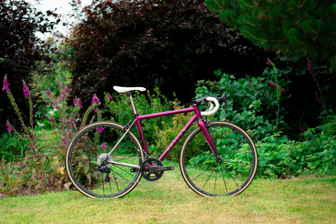 Reilly T640 titanium road bike in purple color with white handlebars