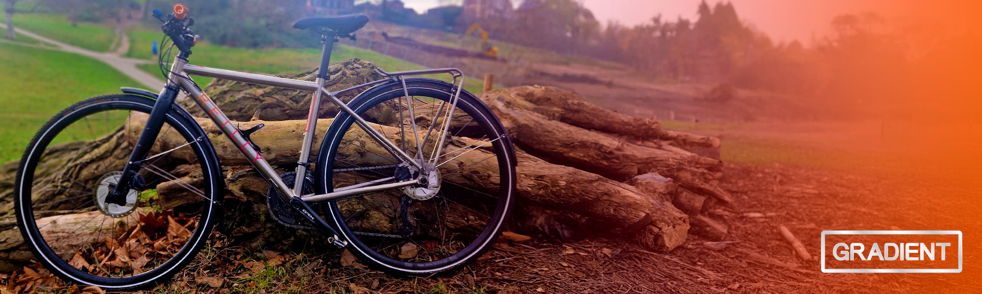 a bike rested in front of some logs.