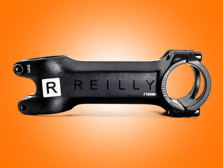 Black bike stem with 'REILLY' branding on an orange background