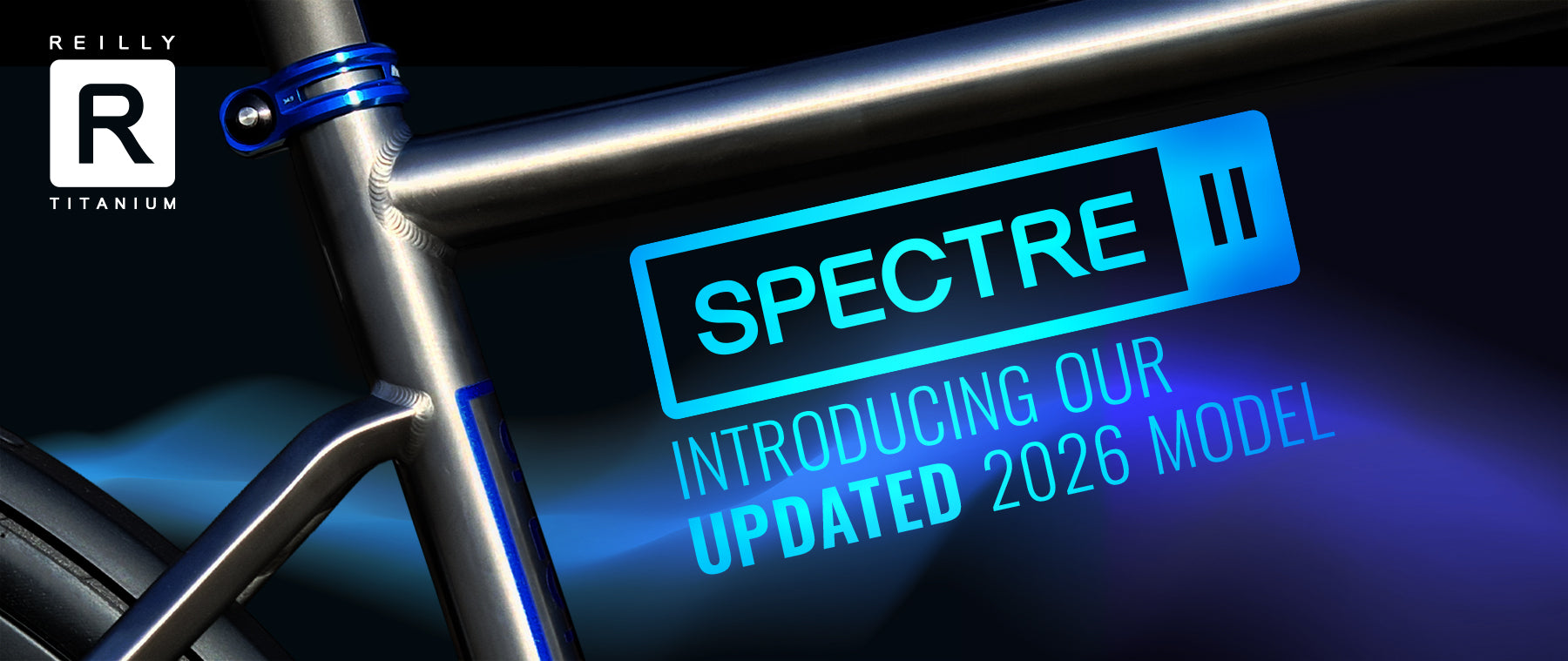 Bicycle frame with 'Spectre' and 'Reilly Titanium' branding on a dark background