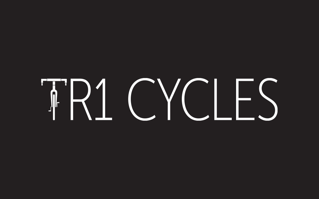 TR1 Cycles logo on a black background