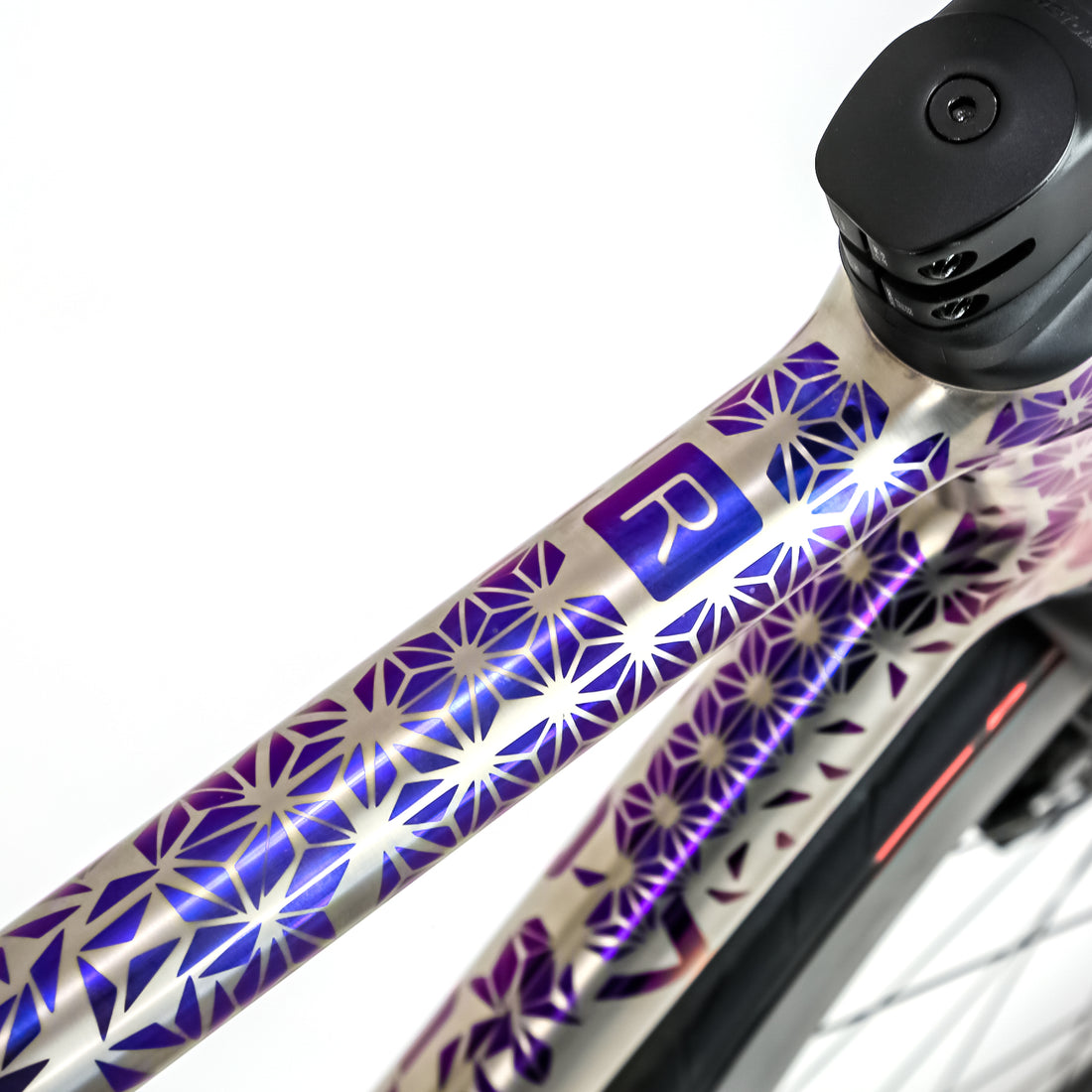 titanium time trial bike with custom geometric frame decals