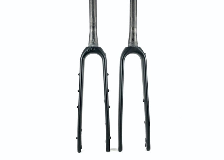 Two Reilly gradient carbon gravel forks with steerer tubes