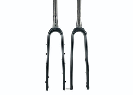 Two Reilly gradient carbon gravel forks with steerer tubes