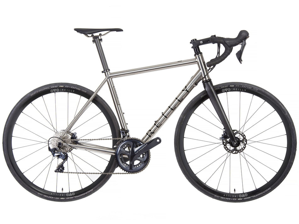 Side view of titanium T325D road bike in brushed titanium with black decals.  Featuring DCR x Reilly wheels and Ultegra groupset.